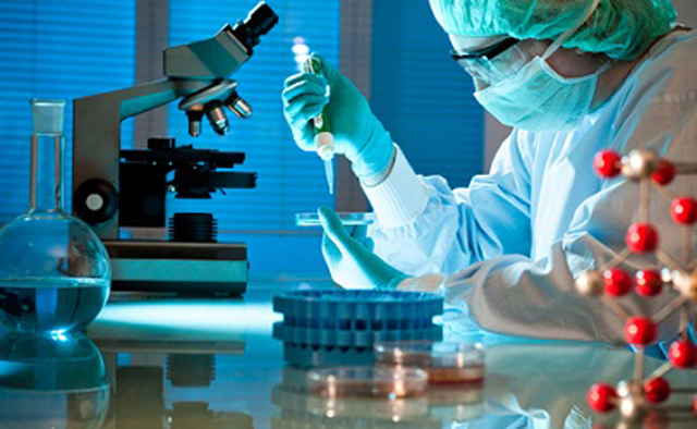 workers testing filling sealing samples 實驗室測試帶管填充密封機.jpg